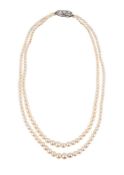 A TWO ROW CULTURED PEARL NECKLACE TO A DIAMOND SET CLASP