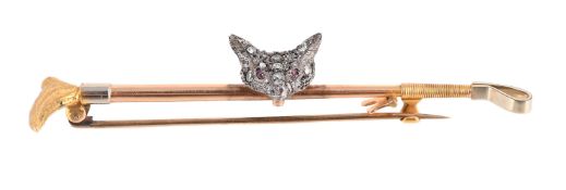 A MID 20TH CENTURY DIAMOND AND RUBY FOX MASK AND RIDING CROP STOCK PIN