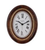 CARTER, MUST DE CARTIER, REF. 7509, A GILT METAL AND BROWN LACQUER DESK ALARM CLOCK