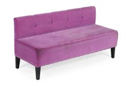 A PINK UPHOLSTERED LOW BANQUETTE, OF RECENT MANUFACTURE