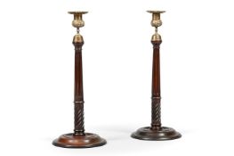 A PAIR OF GEORGE III MAHOGANY CANDLESTICKS, IN SCOTTISH STYLE, 19TH CENTURY
