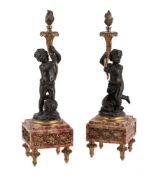A PAIR OF GILT AND PATINATED BRONZE MODELS OF CHERUBS, FRENCH, LATE 19TH OR EARLY 20TH CENTURY