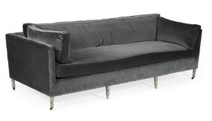 A DARK GREY UPHOLSTERED AND LIMED OAK SOFA, OF RECENT MANUFACTURE