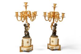 A PAIR OF GILT AND PATINATED BRONZE AND WHITE MARBLE FIGURAL CANDELABRA, FRENCH, LATE 19TH CENTURY