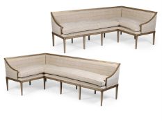 A MATCHED PAIR OF SILVERED WOOD AND UPHOLSTERED CORNER SETTEES, OF RECENT MANUFACTURE