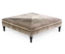 AN UPHOLSTERED AND EBONISED OTTOMAN, OF RECENT MANUFACTURE