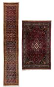 A FERAGHAN RUNNER AND A HAMADAN RUG