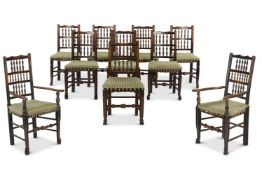 A MATCHED SET OF TEN ASH AND BEECH SPINDLE BACK DINING CHAIRS