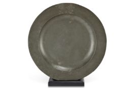 AN EXCEPTIONALLY LARGE CHARLES II PEWTER BROAD-RIM CHARGER, CIRCA 1660-1670
