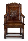 A COMMONWEALTH OAK JOINED ARMCHAIR PROBABLY SOMERSET OR GLOUCESTERSHIRE, DATED 1656