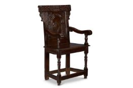A CHARLES I OAK WAINSCOT ARMCHAIR, DATED 1635