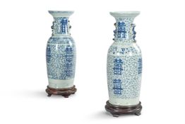 A PAIR OF CHINESE BLUE AND WHITE PORCELAIN TWO-HANDLED 'MARRIAGE' FLOOR VASES, 19TH CENTURY