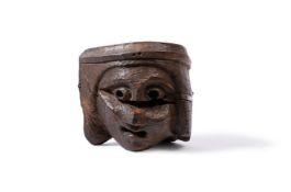 A GOTHIC OAK CORBEL OF A HEAD, 15TH CENTURY