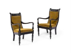 Y A PAIR OF CEYLONESE SOLID EBONY AND UPHOLSTERED ARMCHAIRS, 19TH CENTURY