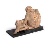 A LARGE TERRACOTTA FIGURE OF A RECLINING NUDE WOMAN, PROBABLY FRENCH