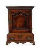 A GEORGE II OAK TABLE TOP CUPBOARD, CIRCA 1740