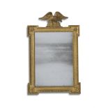 A GEORGE II CARVED GILTWOOD MIRROR, IN THE MANNER OF WILLIAM KENT, CIRCA 1740
