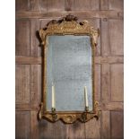 A GEORGE I GILTWOOD AND GILT GESSO GIRANDOLE MIRROR, CIRCA 1725