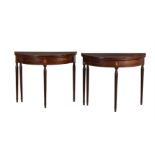 A PAIR OF GEORGE III MAHOGANY AND LINE INLAID DEMI-LUNE TEA TABLES, CIRCA 1790