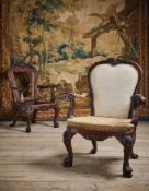 A PAIR OF CARVED WALNUT ARMCHAIRS, IN GEORGE II STYLE, POSSIBLY INCORPORATING SOME PERIOD ELEMENTS