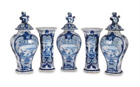 A DUTCH DELFT (DE PORCELEYNE SCHOTEL) BLUE AND WHITE GARNITURE OF BALUSTER AND TRUMPET VASES