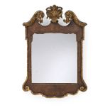 A GEORGE II WALNUT AND PARCEL GILT MIRROR, CIRCA 1740
