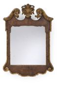 A GEORGE II WALNUT AND PARCEL GILT MIRROR, CIRCA 1740