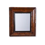 A WILLIAM & MARY FIGURED WALNUT 'CUSHION' FRAME MIRROR, CIRCA 1690