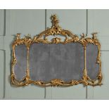 A CARVED GILTWOOD TRIPTYCH OVERMANTEL MIRROR, IN GEORGE III STYLE, 19TH CENTURY