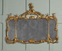 A CARVED GILTWOOD TRIPTYCH OVERMANTEL MIRROR, IN GEORGE III STYLE, 19TH CENTURY