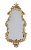A GEORGE III CARVED GILTWOOD MIRROR, CIRCA 1765