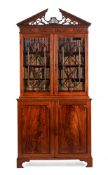 A GEORGE III MAHOGANY CABINET BOOKCASE IN THE MANNER OF THOMAS CHIPPENDALE