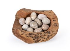 A COLLECTION OF EIGHTEEN CARVED STONE MODELS OF EGGS