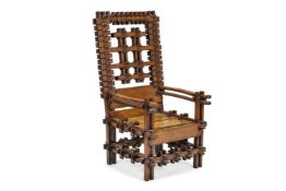 A LARGE 'FOLK ART' OAK AND ELM ARMCHAIR, EARLY 20TH CENTURY