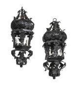A PAIR OF BLACK PAINTED WROUGHT IRON SCROLLING LEAF DECORATED LANTERNS, LATE 20TH CENTURY