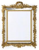 A CARVED GILTWOOD WALL MIRROR, FRENCH, LATE 19TH CENTURY