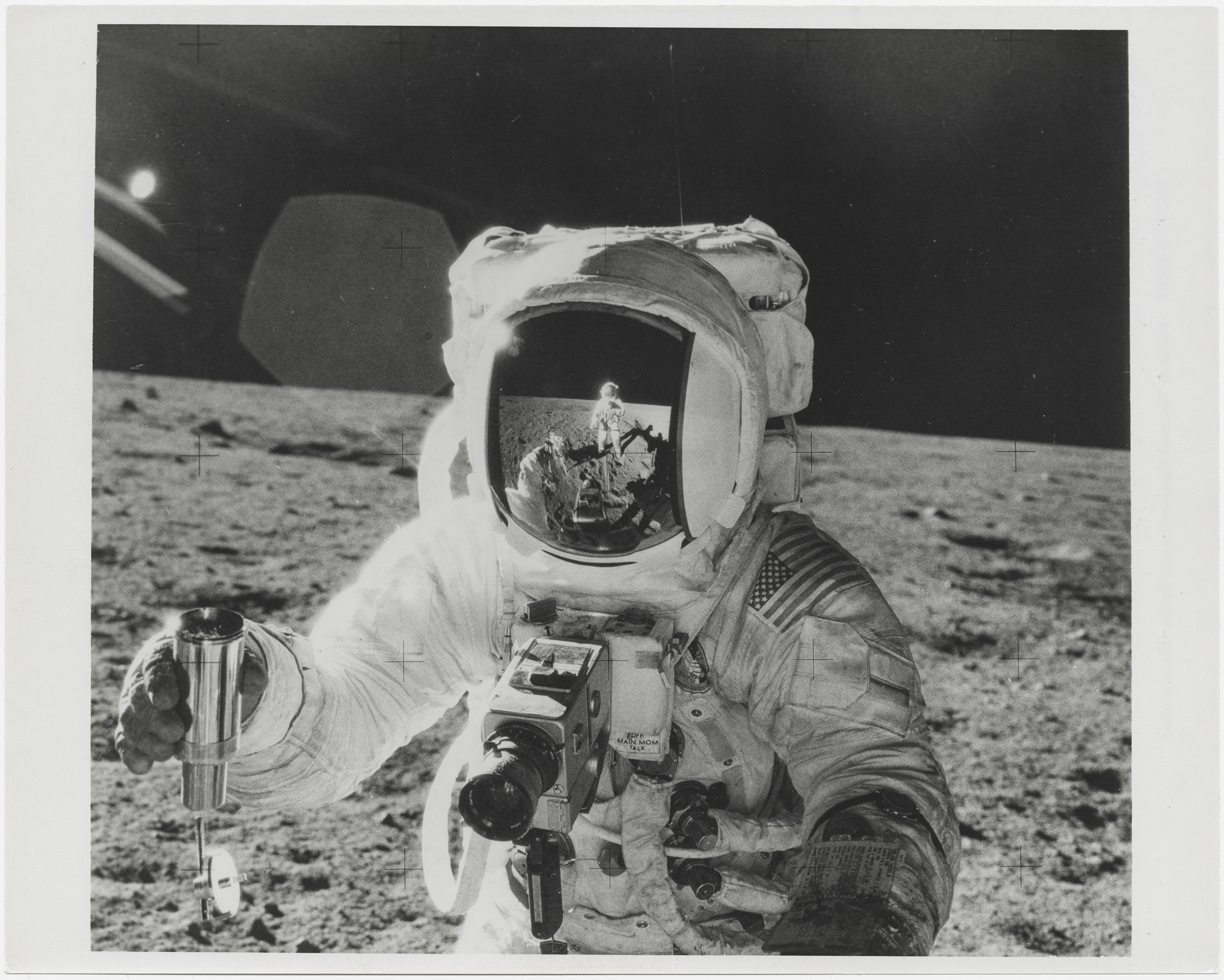 [Apollo 12] PORTRAIT OF ALAN BEAN WITH THE PHOTOGRAPHER’S REFLECTION IN HIS VISOR