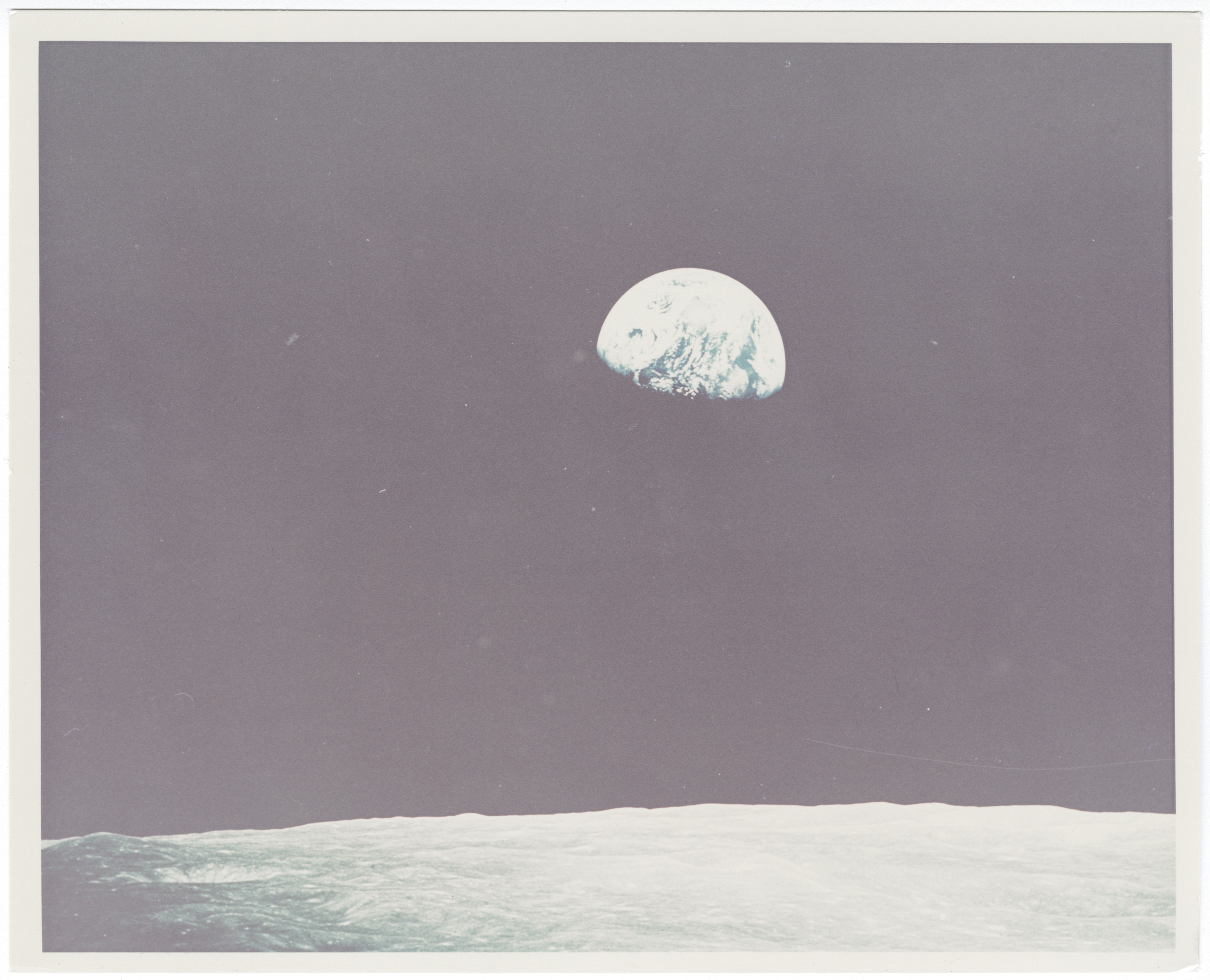 [Apollo 8] EARTHRISE: THE EXTREMELY RARE, UNPUBLISHED COLOR PHOTOGRAPH OF THE FIRST EARTHRISE