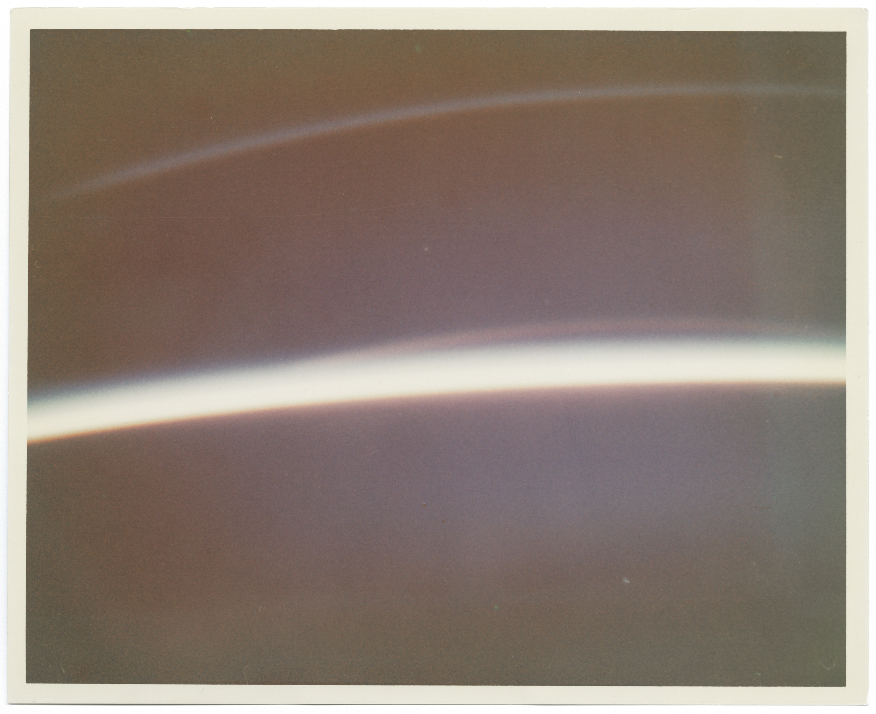 [Mercury Atlas 6] EARTH'S LIMB AT SUNSET CAPTURED BY THE FIRST HUMAN TO PHOTOGRAPH FROM SPACE