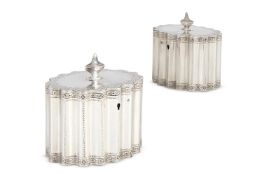 A PAIR OF GEORGE III SILVER SHAPED OVAL TEA CADDIES, AARON LESTOURGEON, LONDON 1781