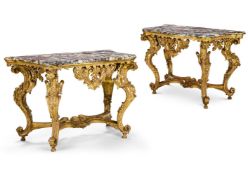 A PAIR OF ITALIAN CARVED GILTWOOD SERPENTINE SIDE TABLES, POSSIBLY GENOA, MID 18TH CENTURY