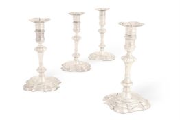 TWO PAIRS OF GEORGE II CAST SILVER CANDLESTICKS