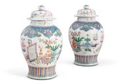 A PAIR OF CHINESE FAMILLE ROSE 'ANTIQUITIES' VASES AND COVERS, 18TH CENTURY