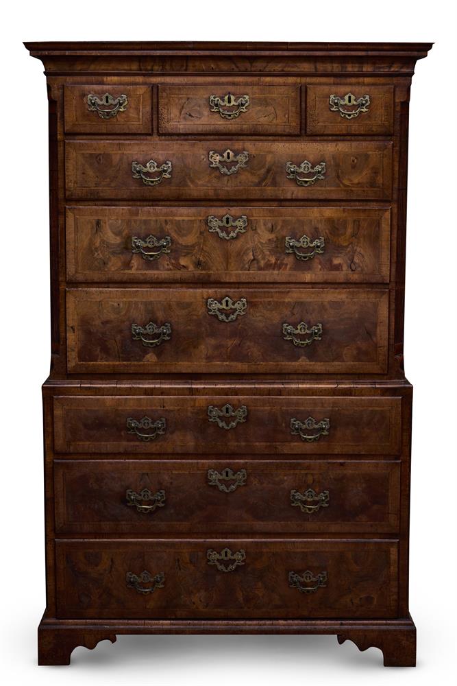 A GEORGE II FIGURED WALNUT AND FEATHERBANDED TALLBOY, CIRCA 1730
