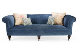 A VICTORIAN EBONISED AND UPHOLSTERED CHESTERFIELD SOFA, CIRCA 1880