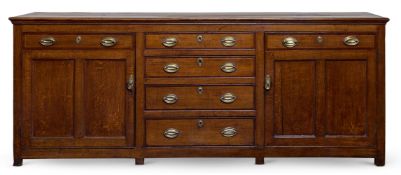 A GEORGE III OAK AND MAHOGANY CROSSBANDED DRESSER BASE, EARLY 19TH CENTURY