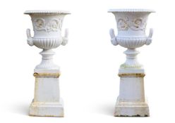 A PAIR OF CAST IRON URNS ON STANDS IN THE HANDYSIDE MANNER, LATE 19TH/EARLY 20TH CENTURY