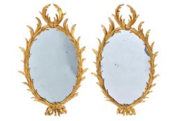 A PAIR OF CARVED GILTWOOD MIRRORS, ONE CIRCA 1760, THE OTHER PROBABLY 20TH CENTURY