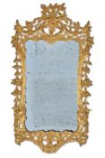 A GEORGE III CARVED GILTWOOD MIRROR, CIRCA 1760