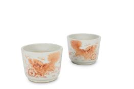 A PAIR OF IRON-RED BUDDHIST LION CACHE POTS, CHINESE
